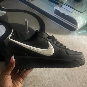 Nike Men’s Black Sneakers with White Swoosh